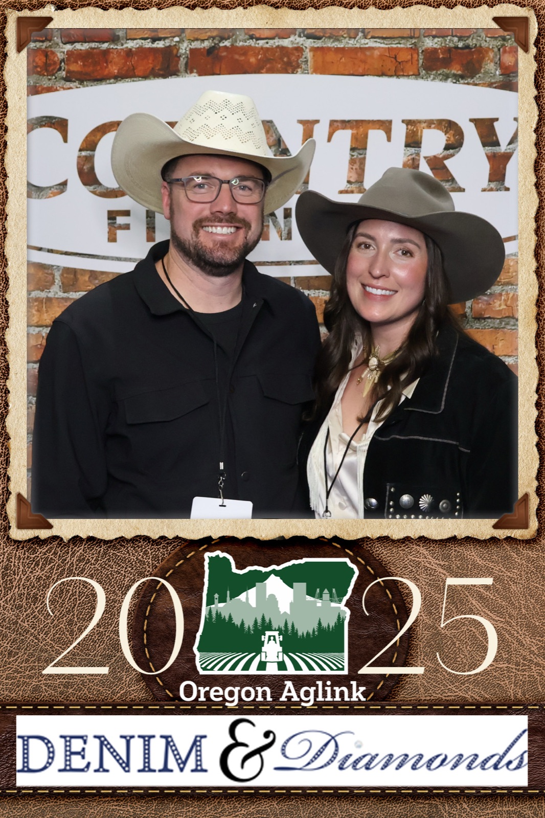 Photo booth print of a smiling couple in cowboy hats, framed with 2025 Oregon Aglink Denim and Diamonds branding