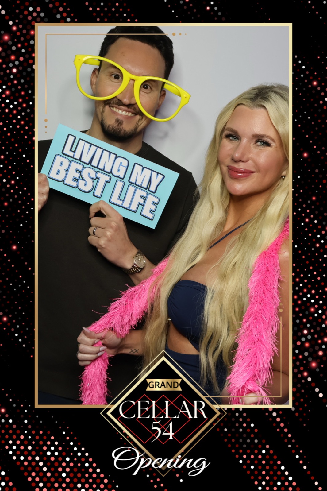 Queen photo booth print of a couple at the Cellar 54 grand opening