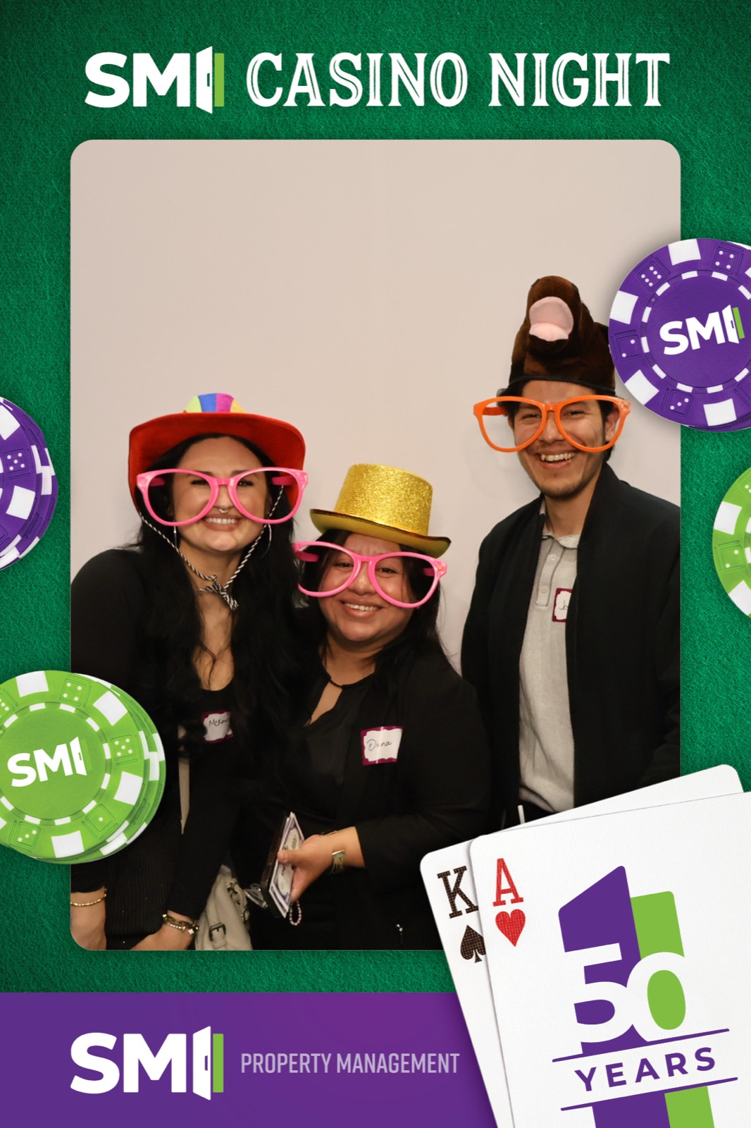 Casino-night photo booth print, three guests in oversized glasses on a poker-chip template