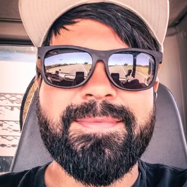 Wes Fisher in a cap and sunglasses